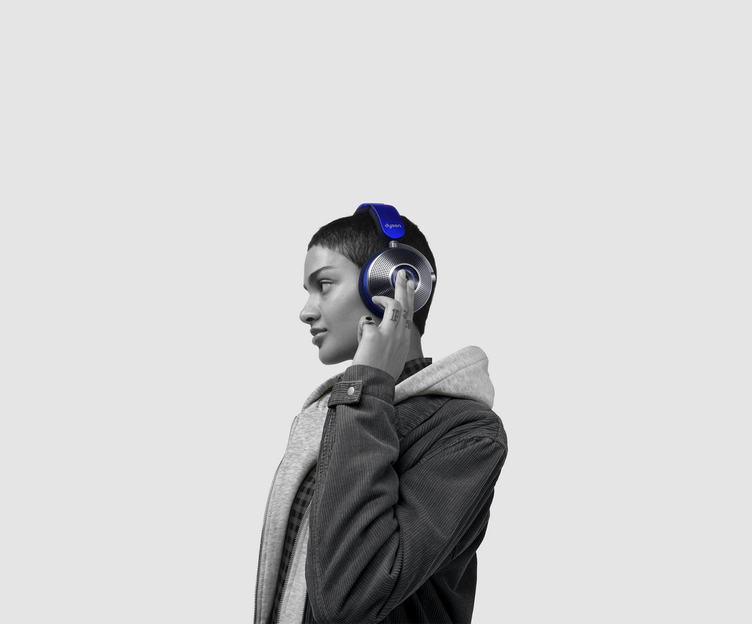 Man wearing Dyson Zone noise-cancelling headphones with visor